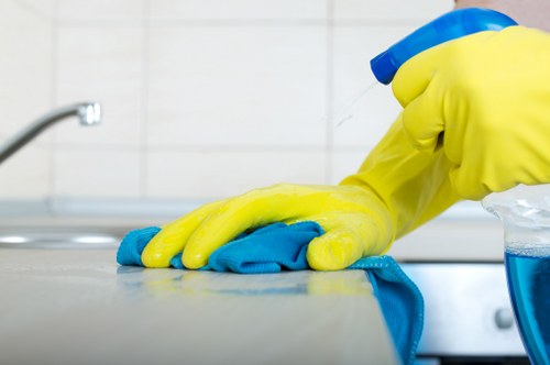 Professional carpet cleaning team following safe working practices
